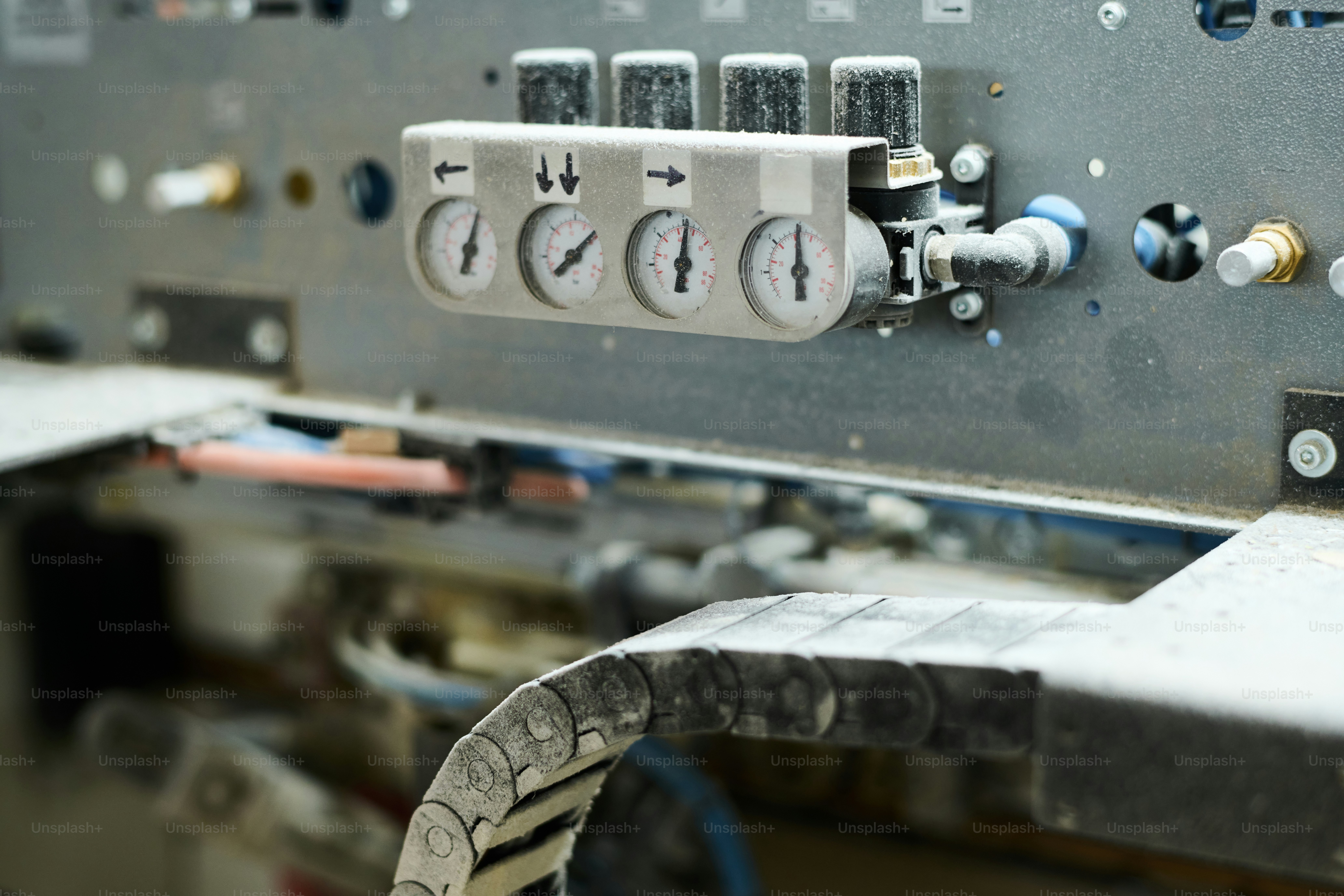 Close-up of indicators showing the pressure on machine equipment at factory