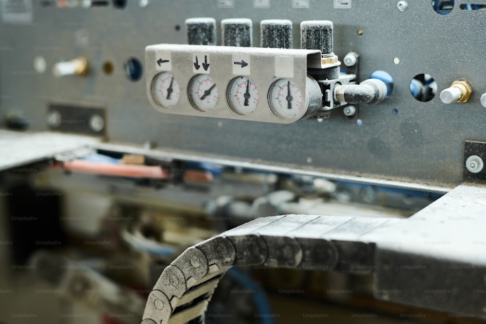 Close-up of indicators showing the pressure on machine equipment at factory