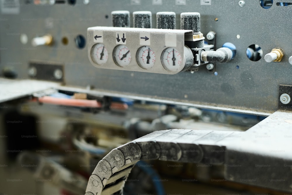 Close-up of indicators showing the pressure on machine equipment at factory