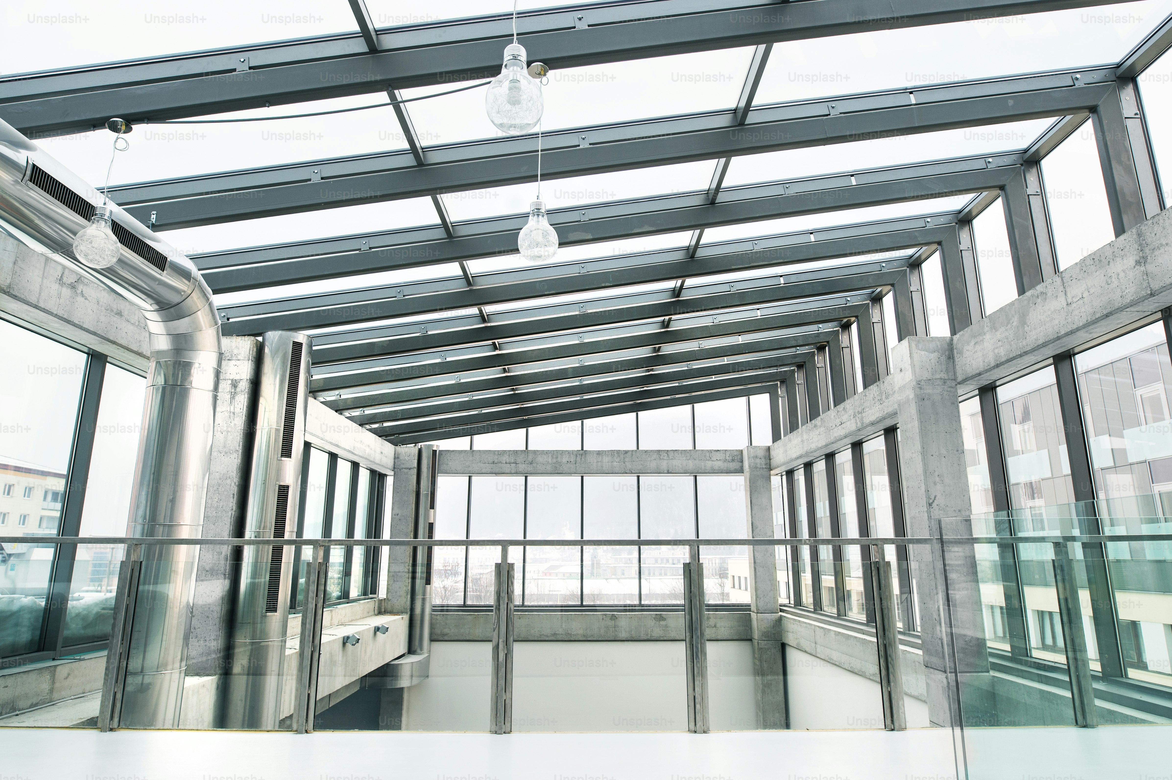 An interior of a modern spacious office glass building