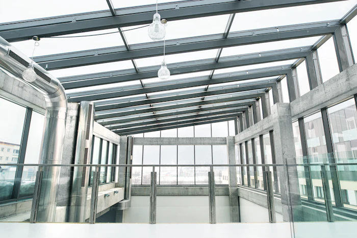 Floor to ceiling uPVC glazing bringing daylight into an open interior