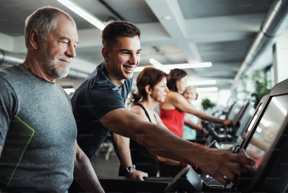 Happy Group Of People At The Gym With Trainer And Senior Women Stock Photo,  Picture and Royalty Free Image. Image 63538282.