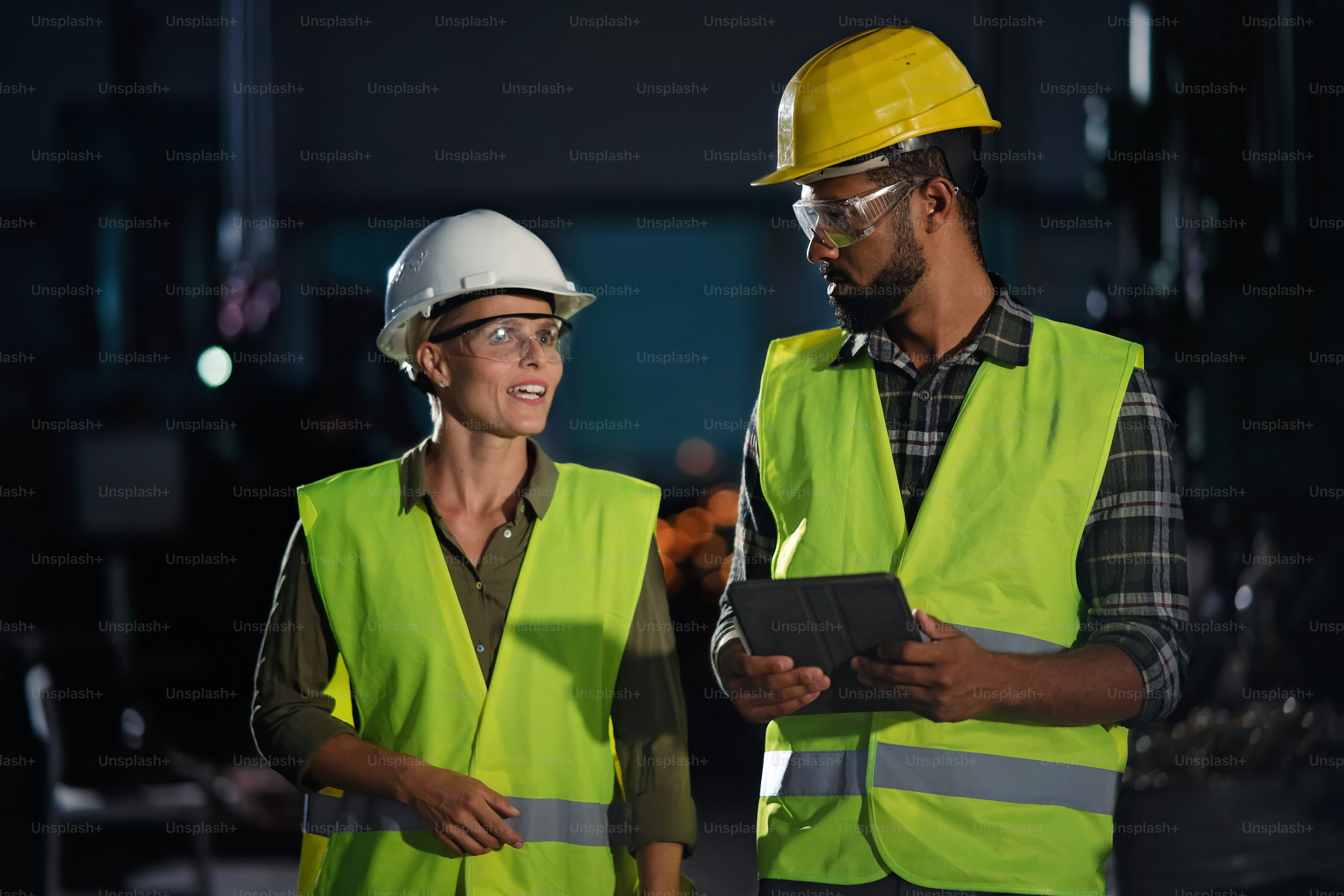 A portrait of industrial inspectors doing a general check up indoors at ...