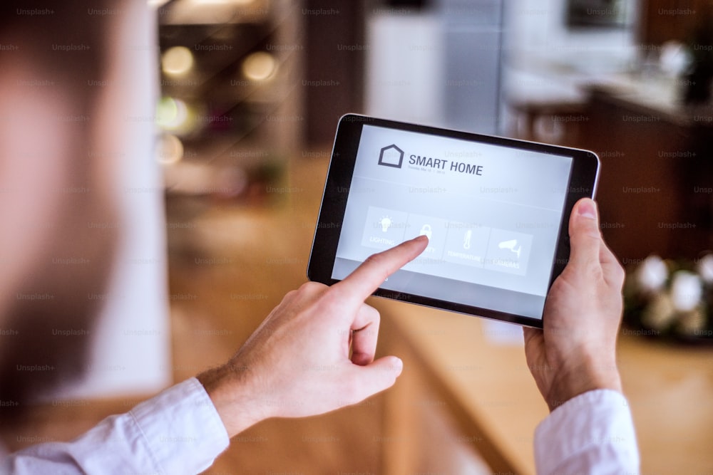 A tablet with smart home control system.A tablet with smart home control system.