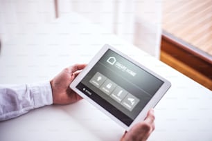 A tablet with smart home control system.A tablet with smart home control system.