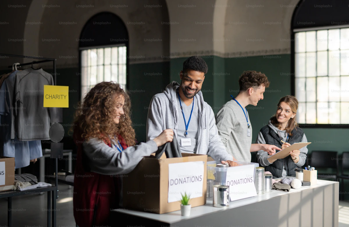 Volunteers packing donation boxes for a charity food drive