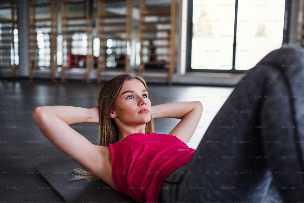 Young Pretty Girl Work Out In The Gym Stock Photo - Download Image