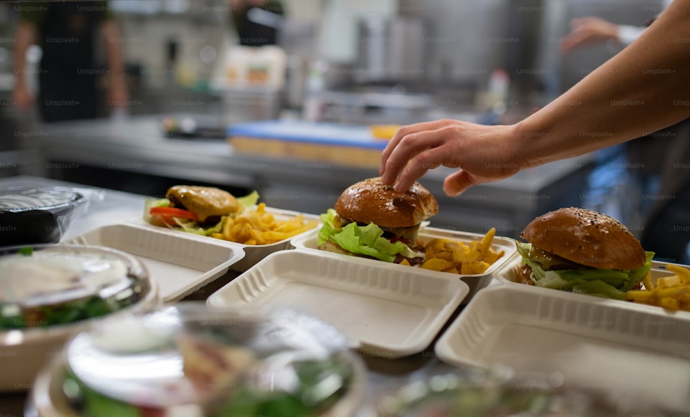 The meals containers prepared for take away in kitchen restaurant.