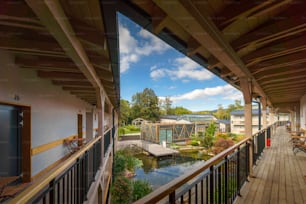 A view from terrace of modern hotel with garden pond