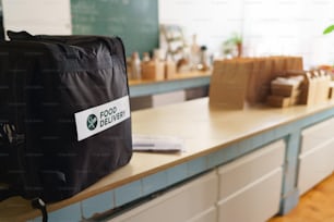 Take away boxes with lunch prepared for a delivery in thermo bag in restaurant.