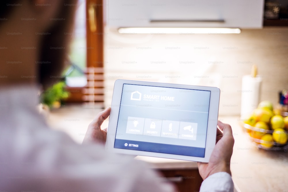 A tablet with smart home control system.A tablet with smart home control system.