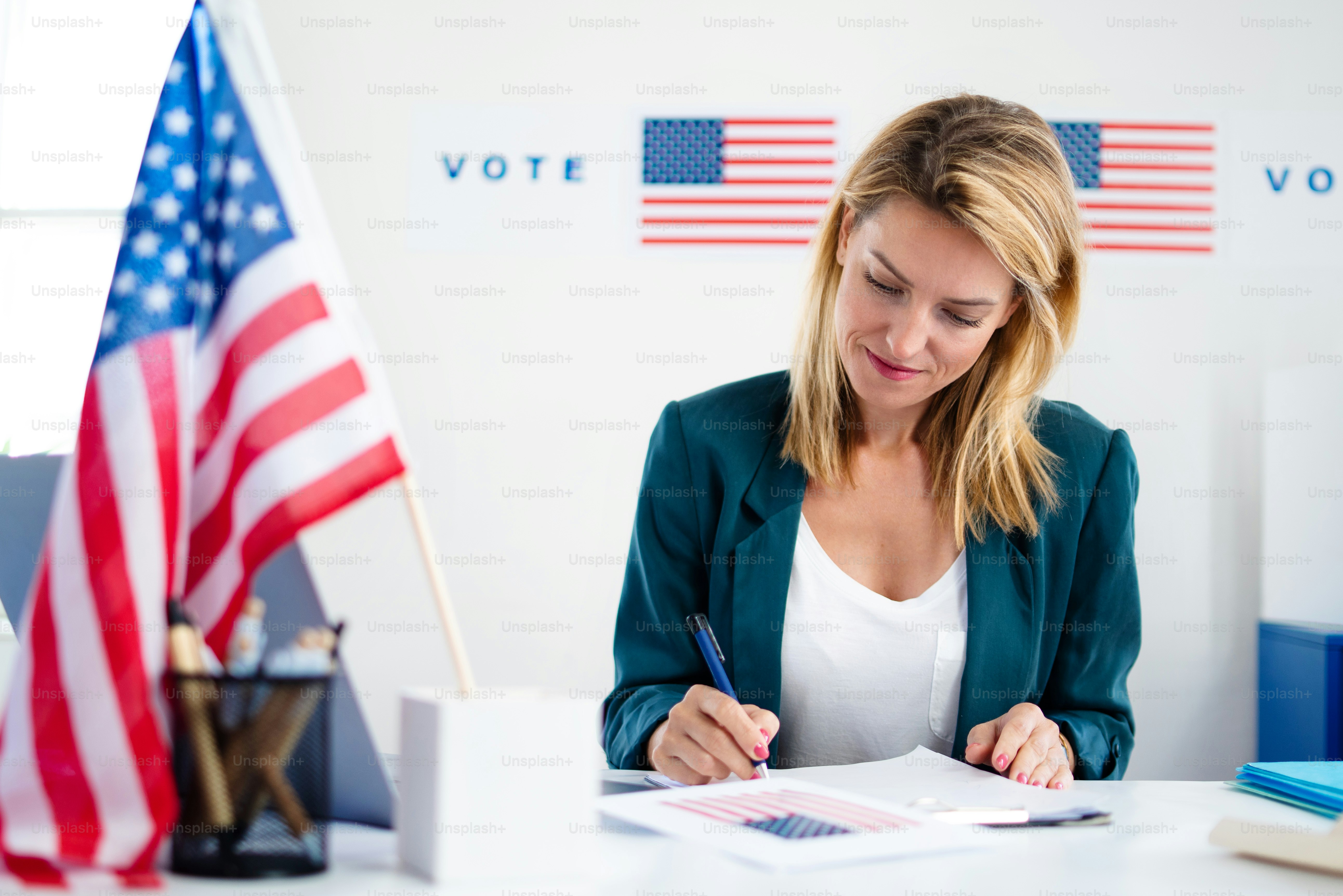 Woman member of electoral commission in polling place, usa elections.