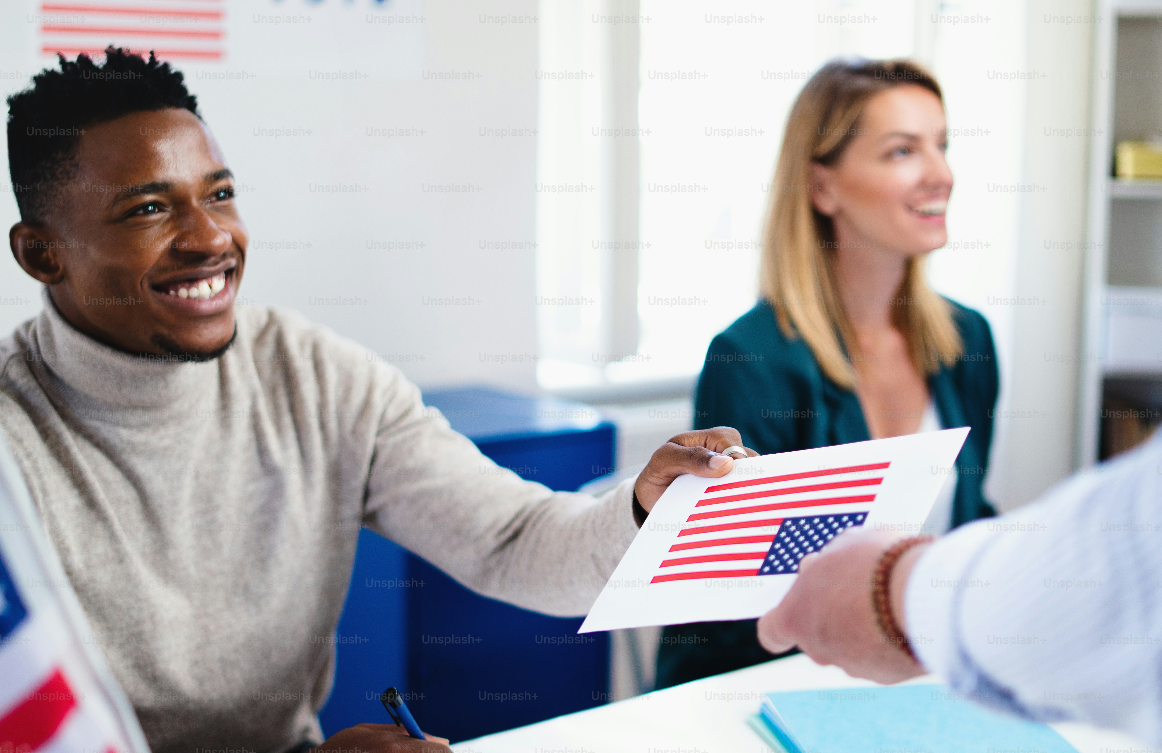 Multi-ethnic members of electoral commission in polling place, usa ...