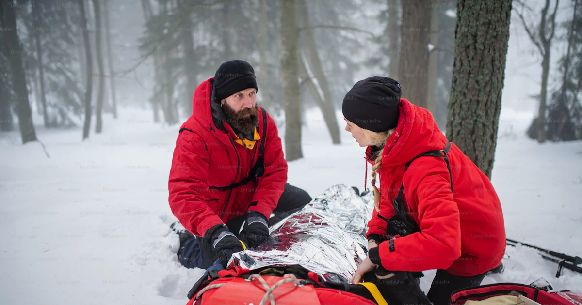 Paramedics from mountain rescue service provide operation outdoors in ...