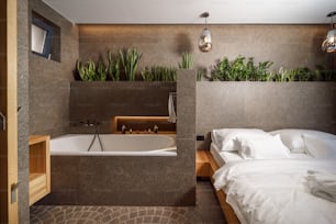 고급 호텔에 욕조가 있는 현대적인 침실 스위트의 인테리어