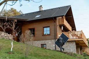 A man worker carrying solar panel for installing solar modul system on house.