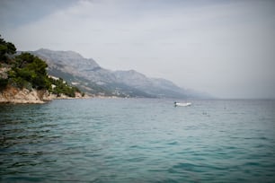 A landscape of town in the Adriatic sea coast under mountain in Croatia, during summer sunny day