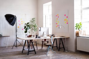 The interior of an empty modern office or a studio after work.