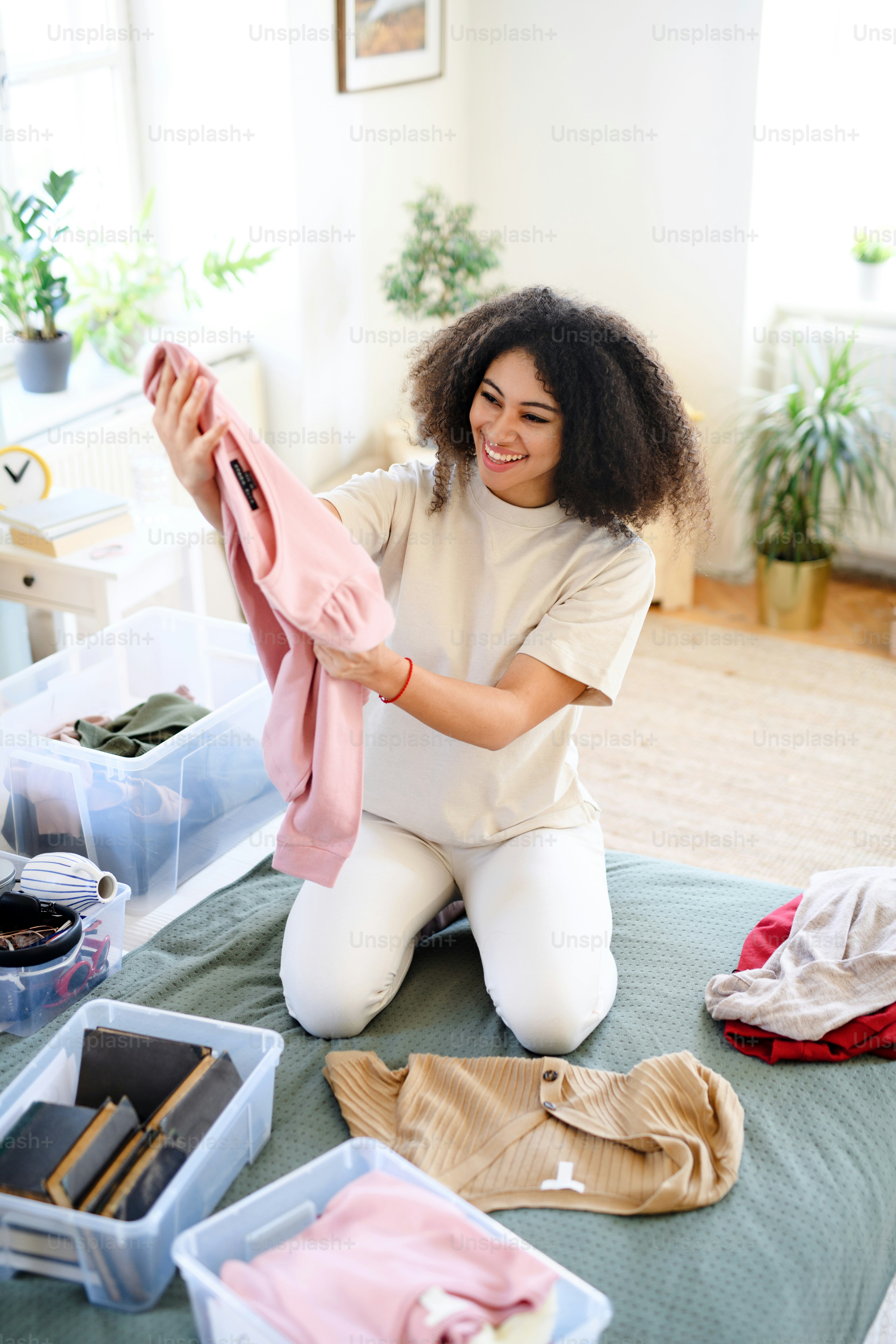 A person sorting through clothing in their closet