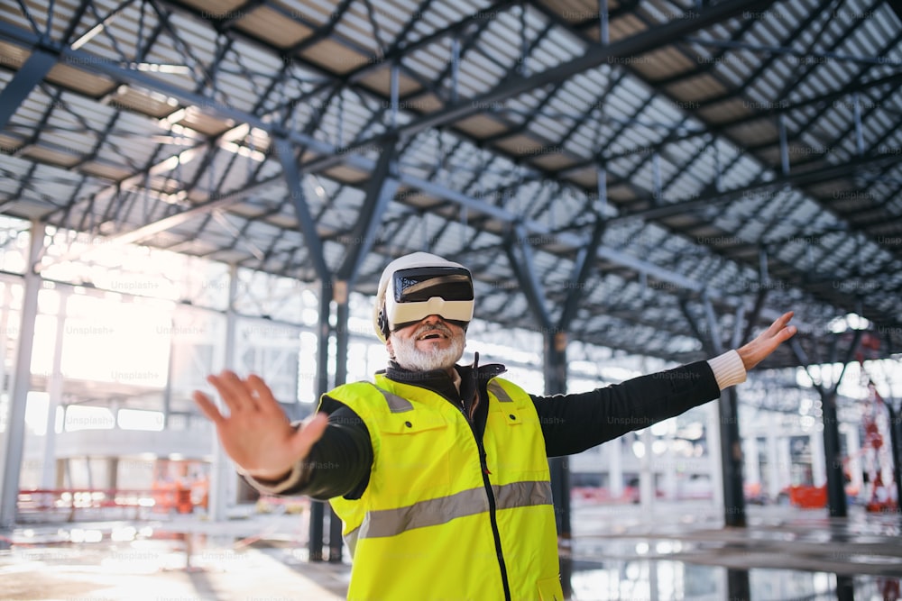 Man engineer using VR goggles outdoors on construction site.