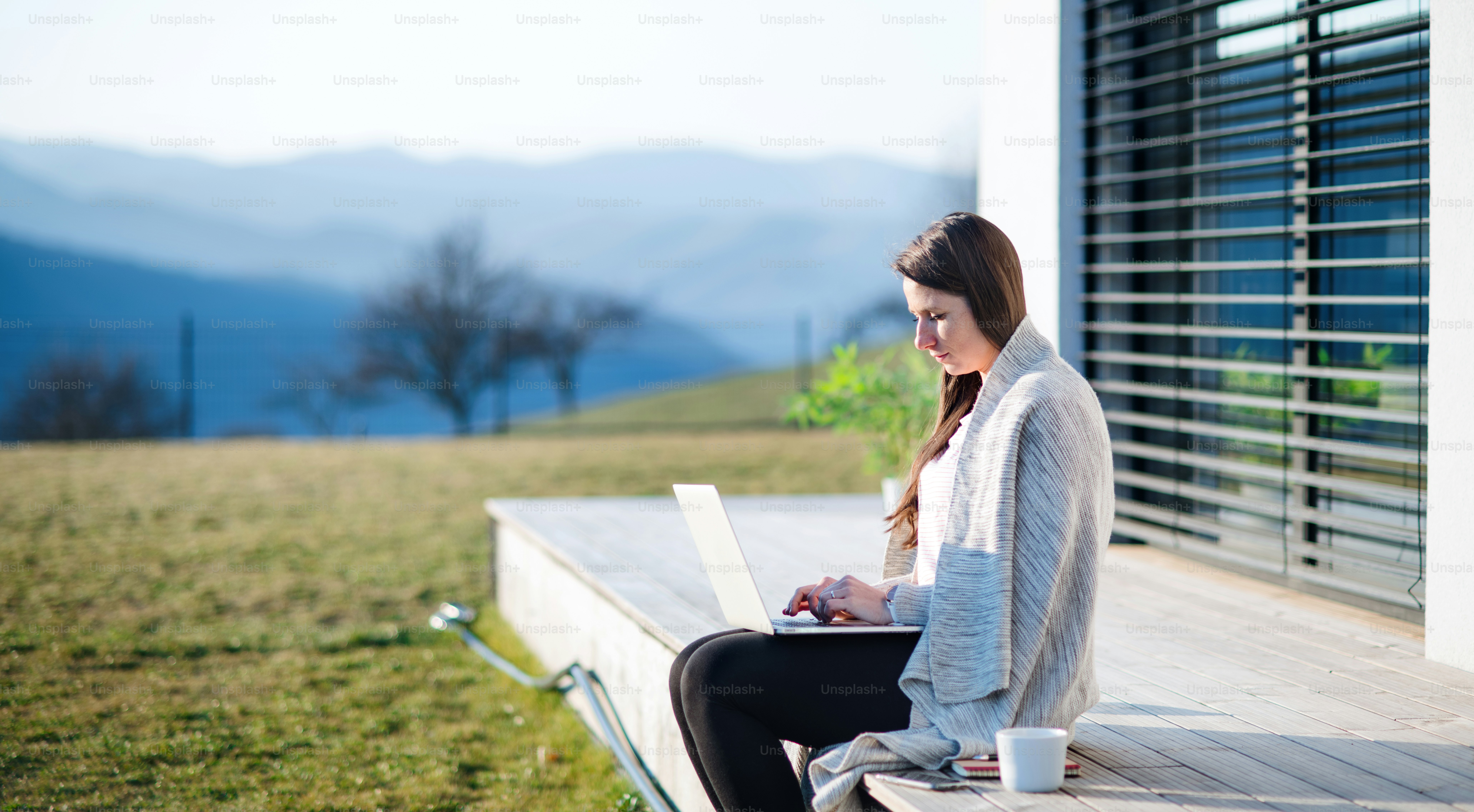 Woman with face mask working outdoors at home, Corona virus and quarantine concept.