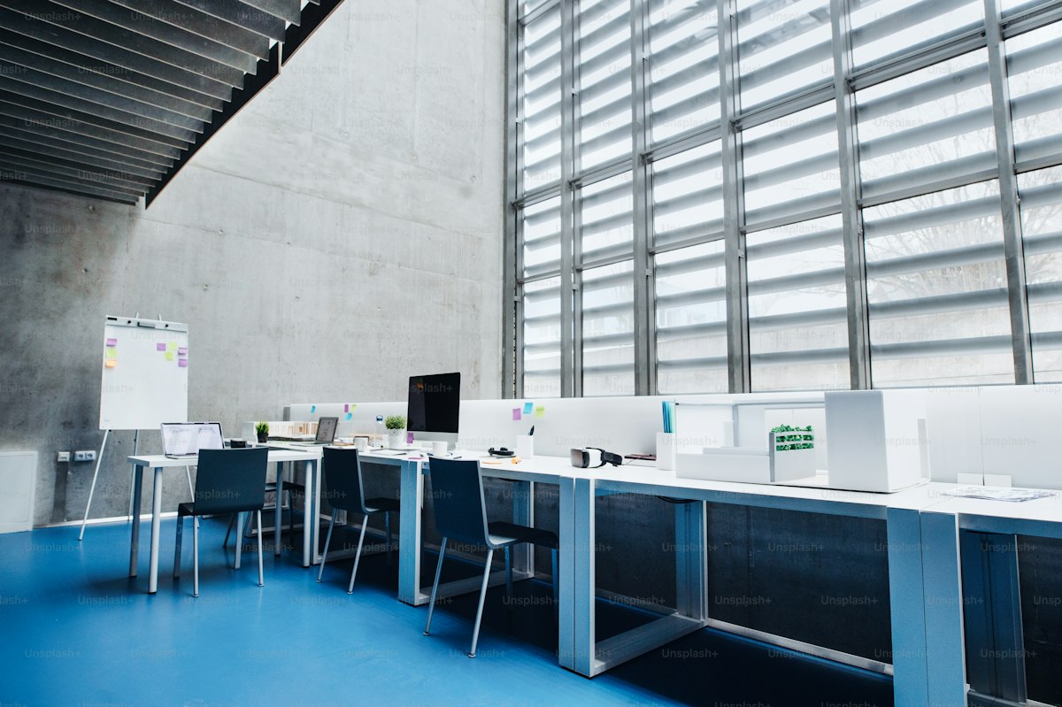 Modern office with computers and architectural model