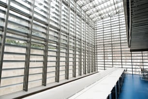 An interior of a modern spacious study room for students in a library or office.