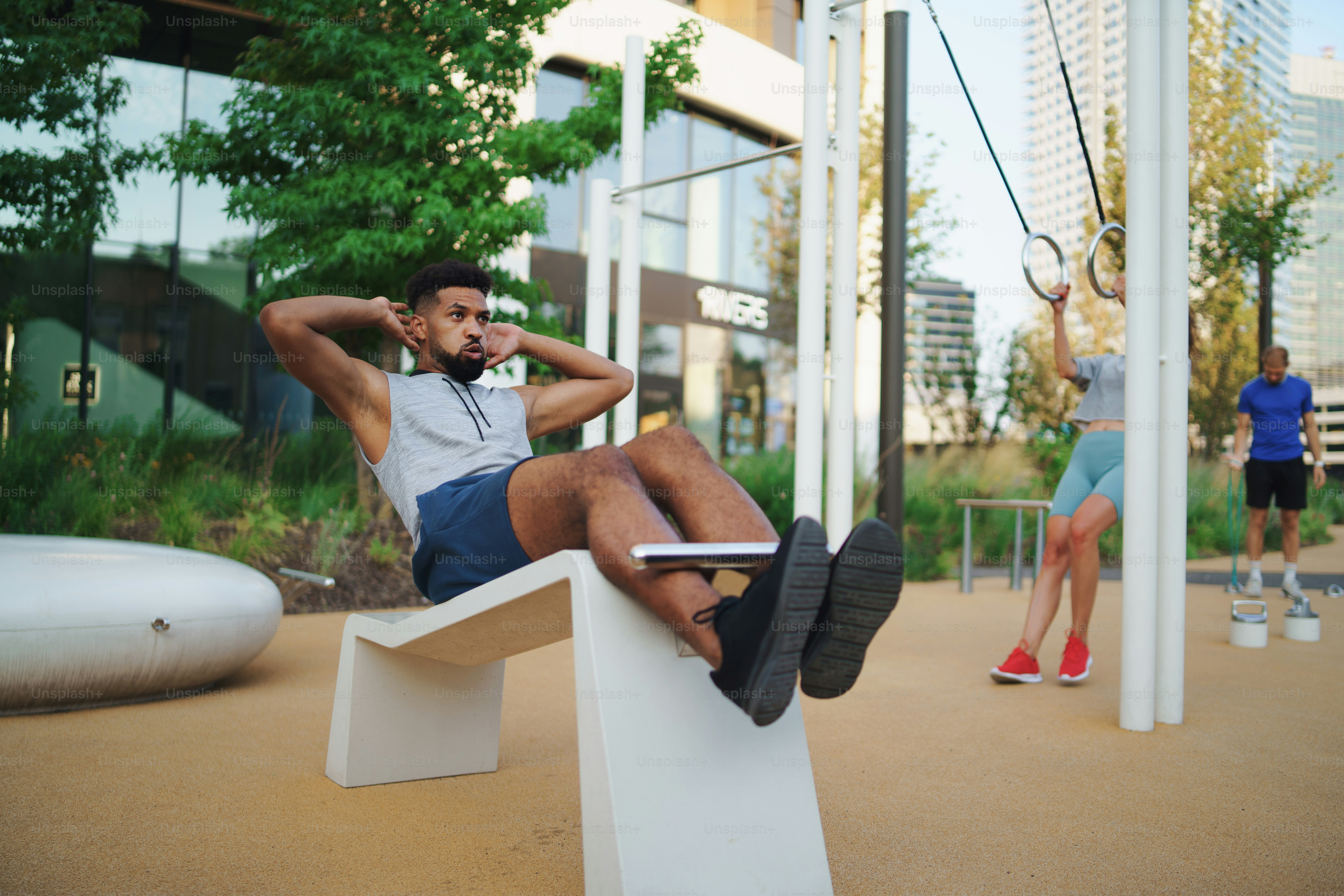 A young man doing workout outdoors in city, exercise and healthy ...