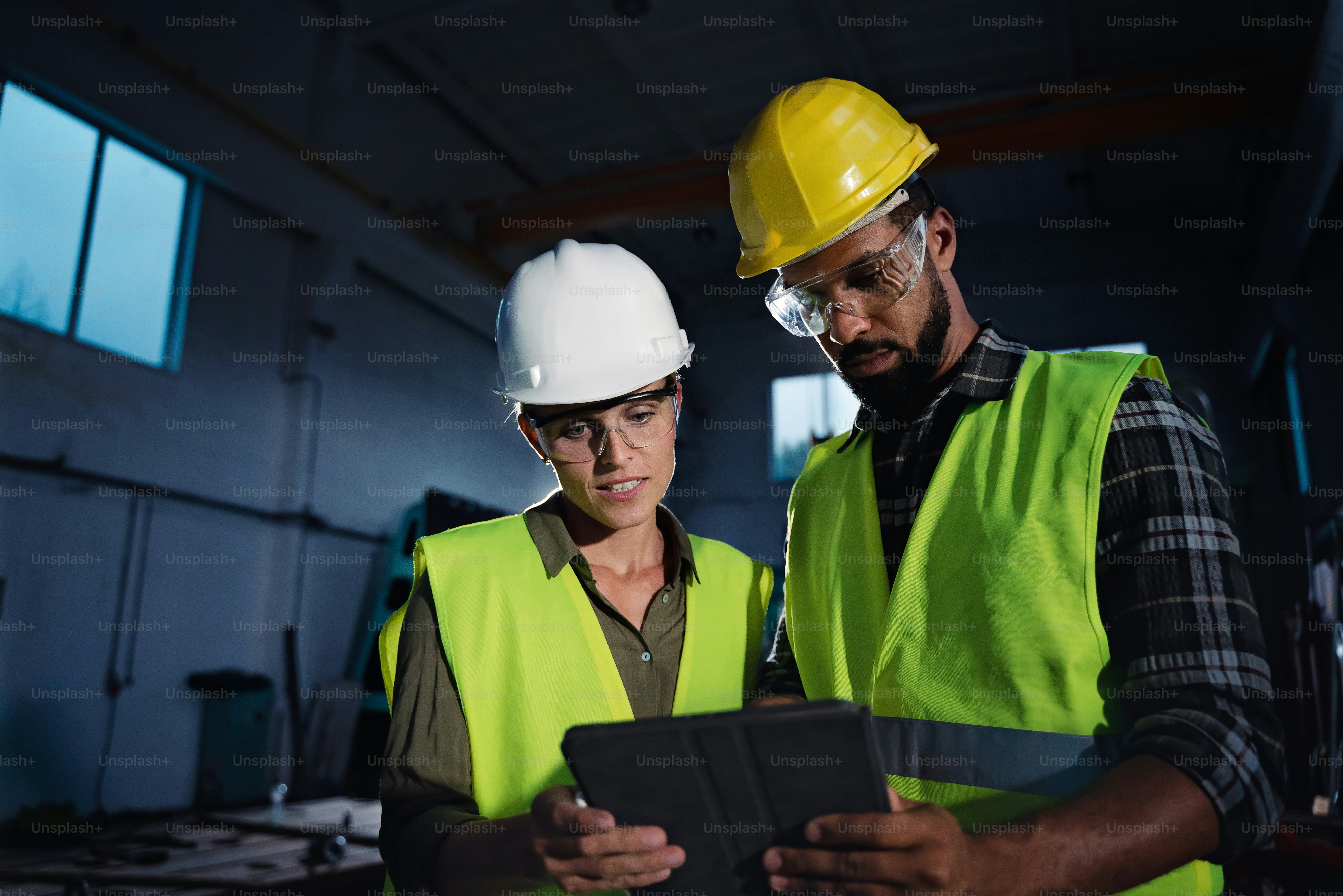 Portrait of industrial inspectors with a tablet doing a general check ...