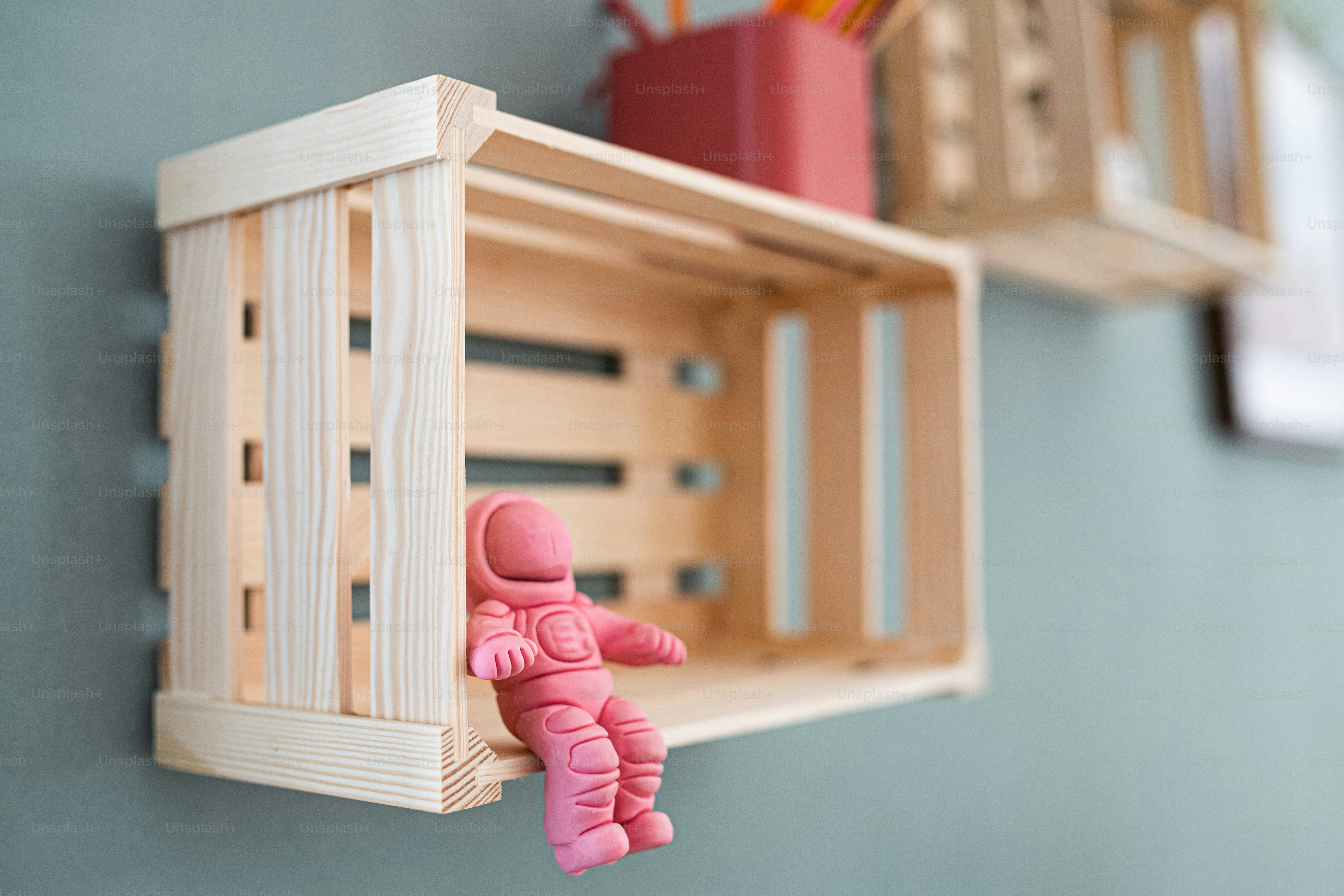 Wooden box shelf with decorations on the wall, a natural decor concept.