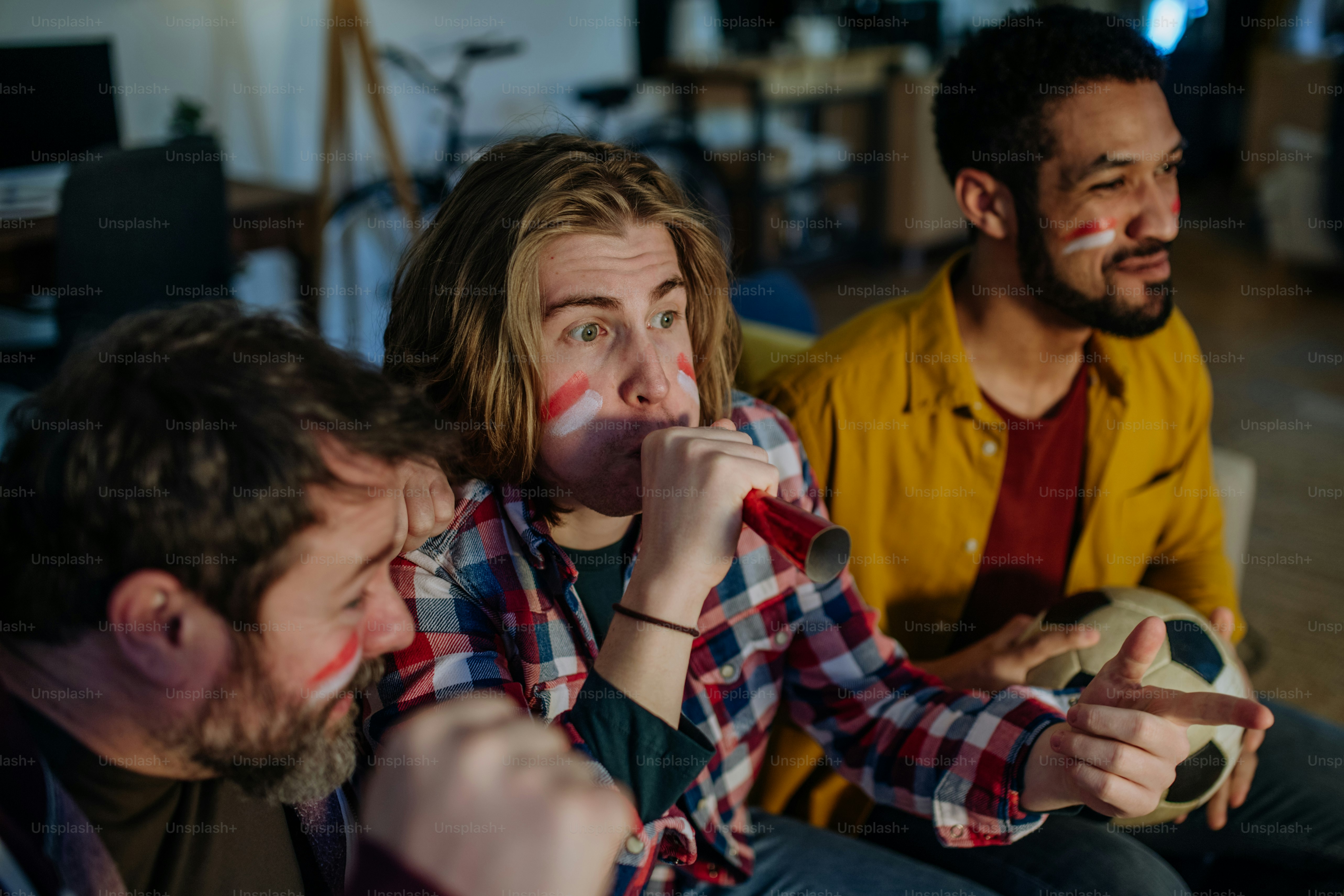 happy-austrian-football-fans-friends-watching-football-at-home-and