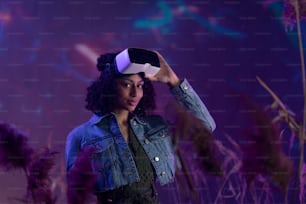 Metaverse digital cyber world technology, girl with virtual reality VR goggles playing augmented reality game, smiling, looking at camera,futuristic lifestyle