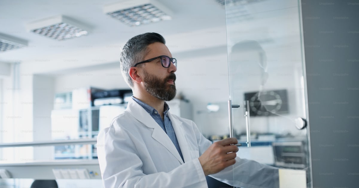A robotics engineer working on desing of modern robotic arm in ...