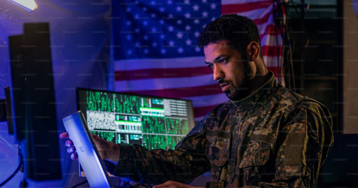 An American hacker in military unifrorm on dark web, cyberwar concept ...