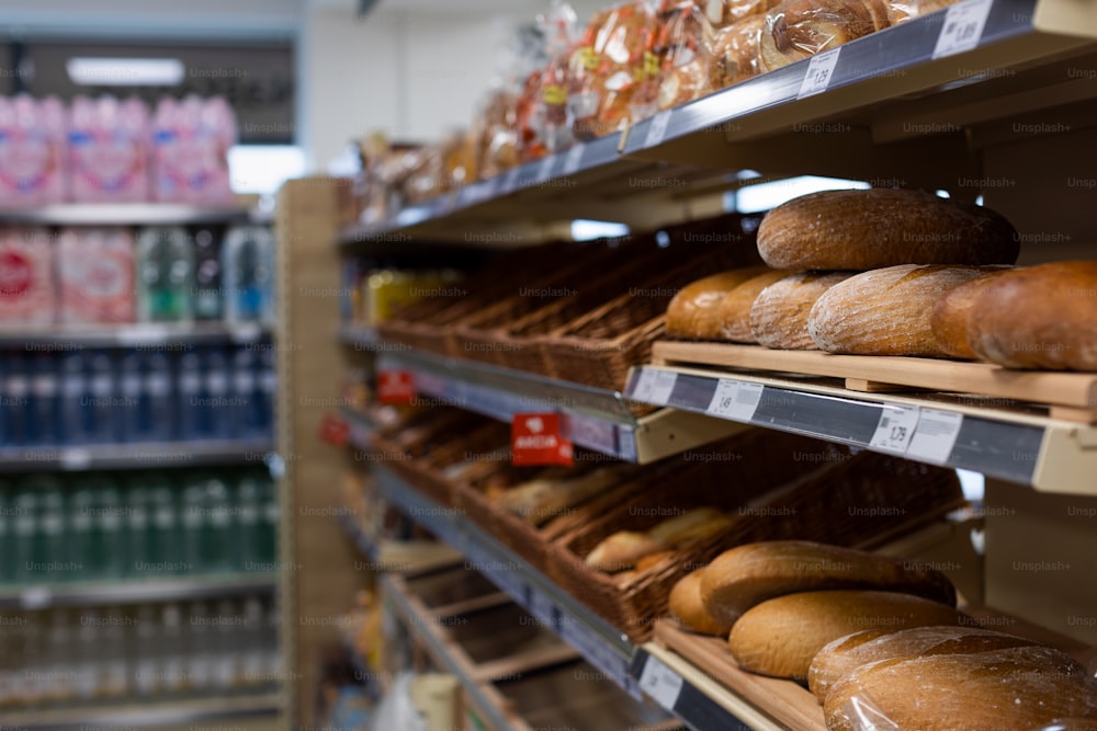 A focus on shelves with bread in a supermarket