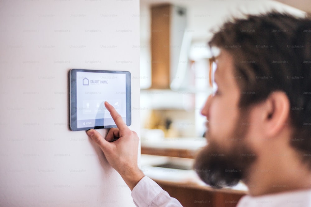 A tablet with smart home control system.A tablet with smart home control system.