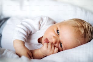 A close-up of a cute newborn baby at home.