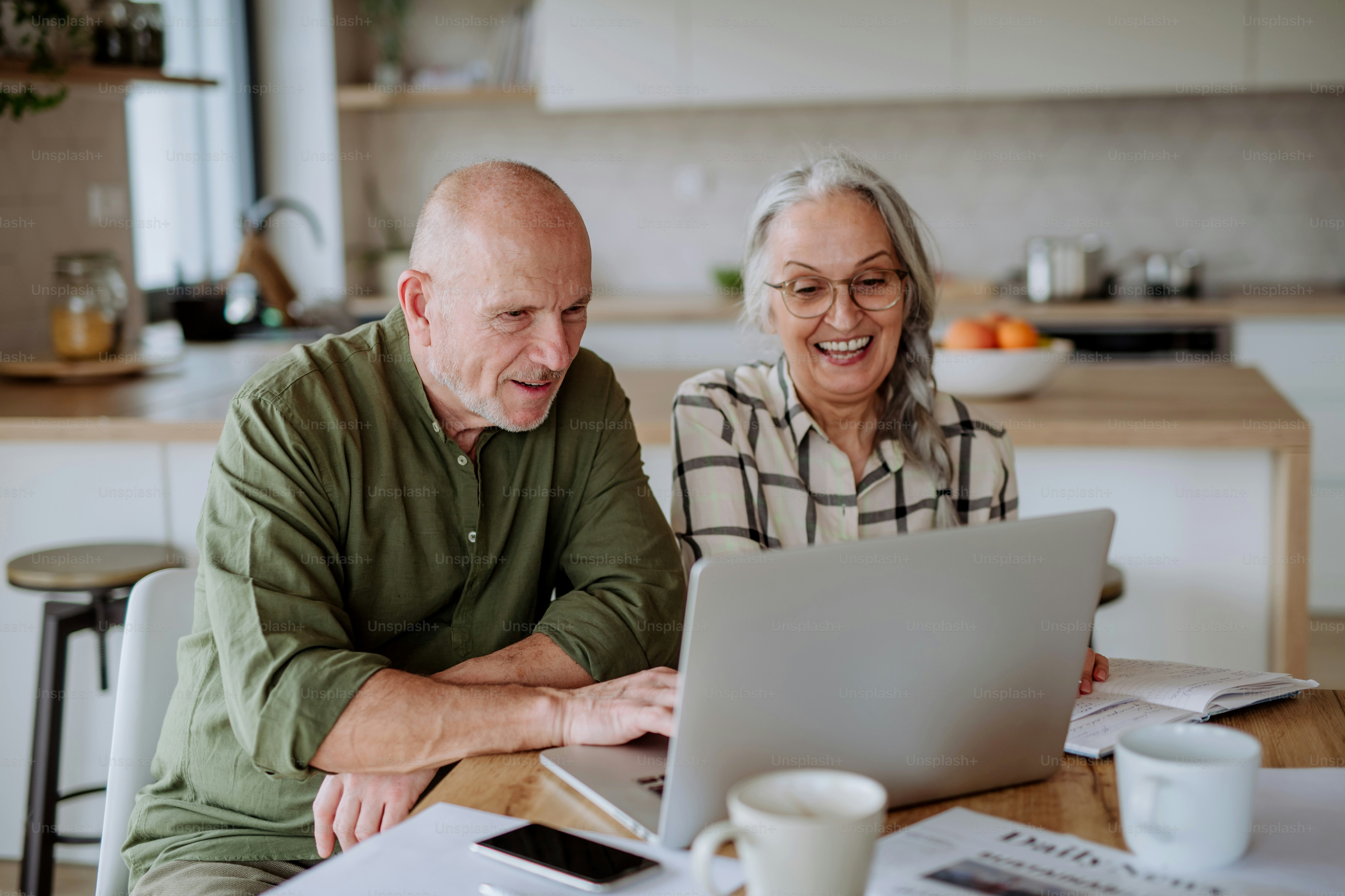 Retired homeowners comparing home equity loans for seniors with financial documents