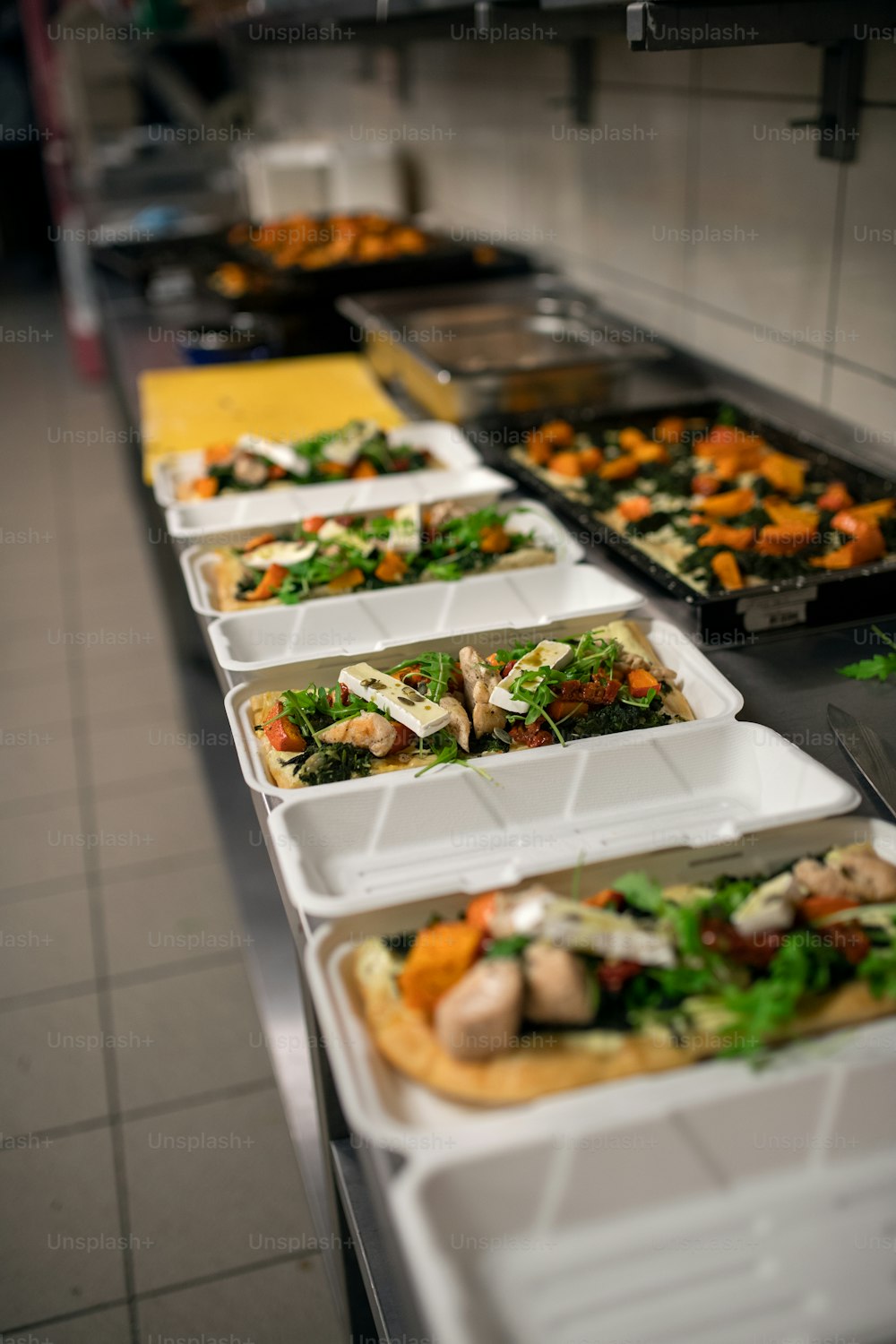 The meals containers prepared for take away in kitchen restaurant.