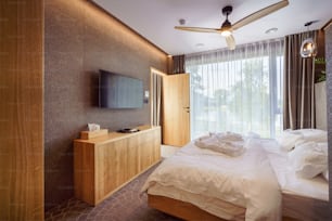 An interior of modern bedroom suite in luxury hotel