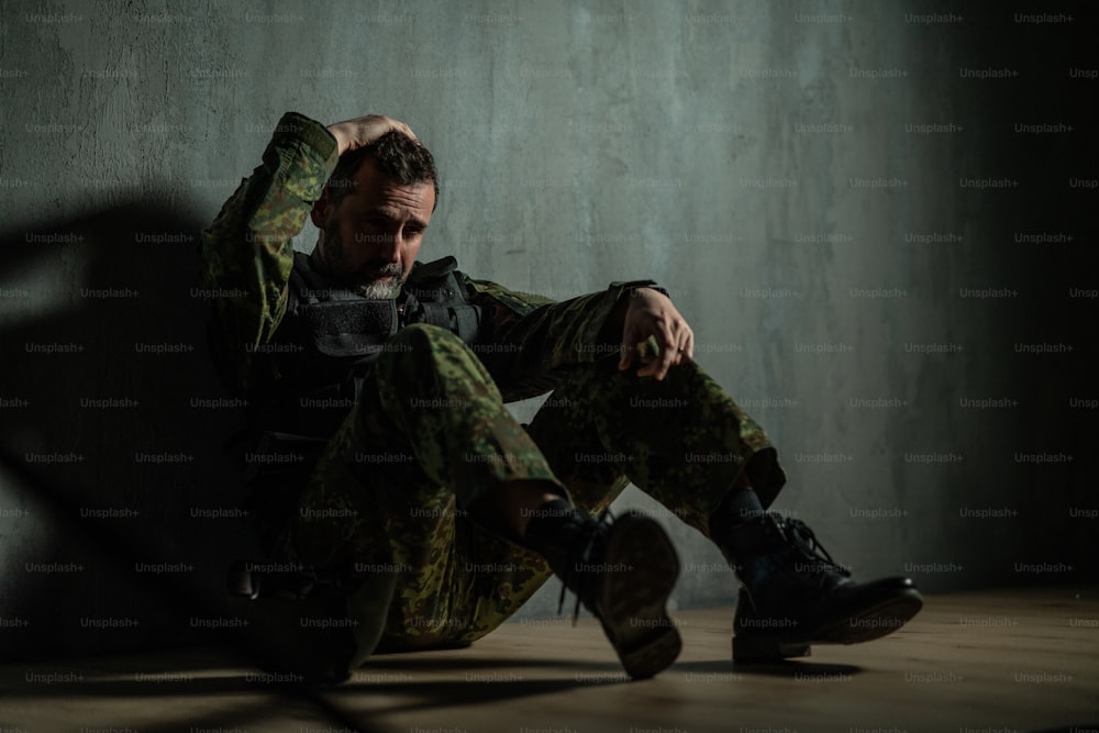 A frustrated military soldier sitting in boot camp