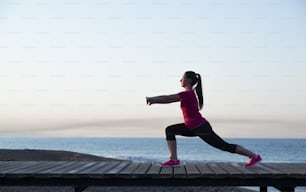 Young woman is running in sunny nature