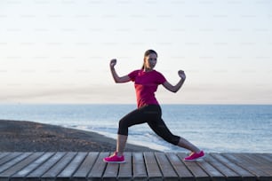 Young woman is running in sunny nature