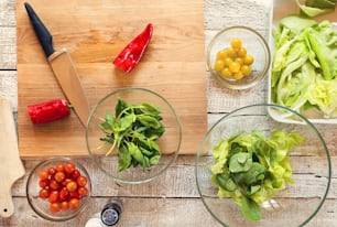 Ingredients for salad laid on wooden table background