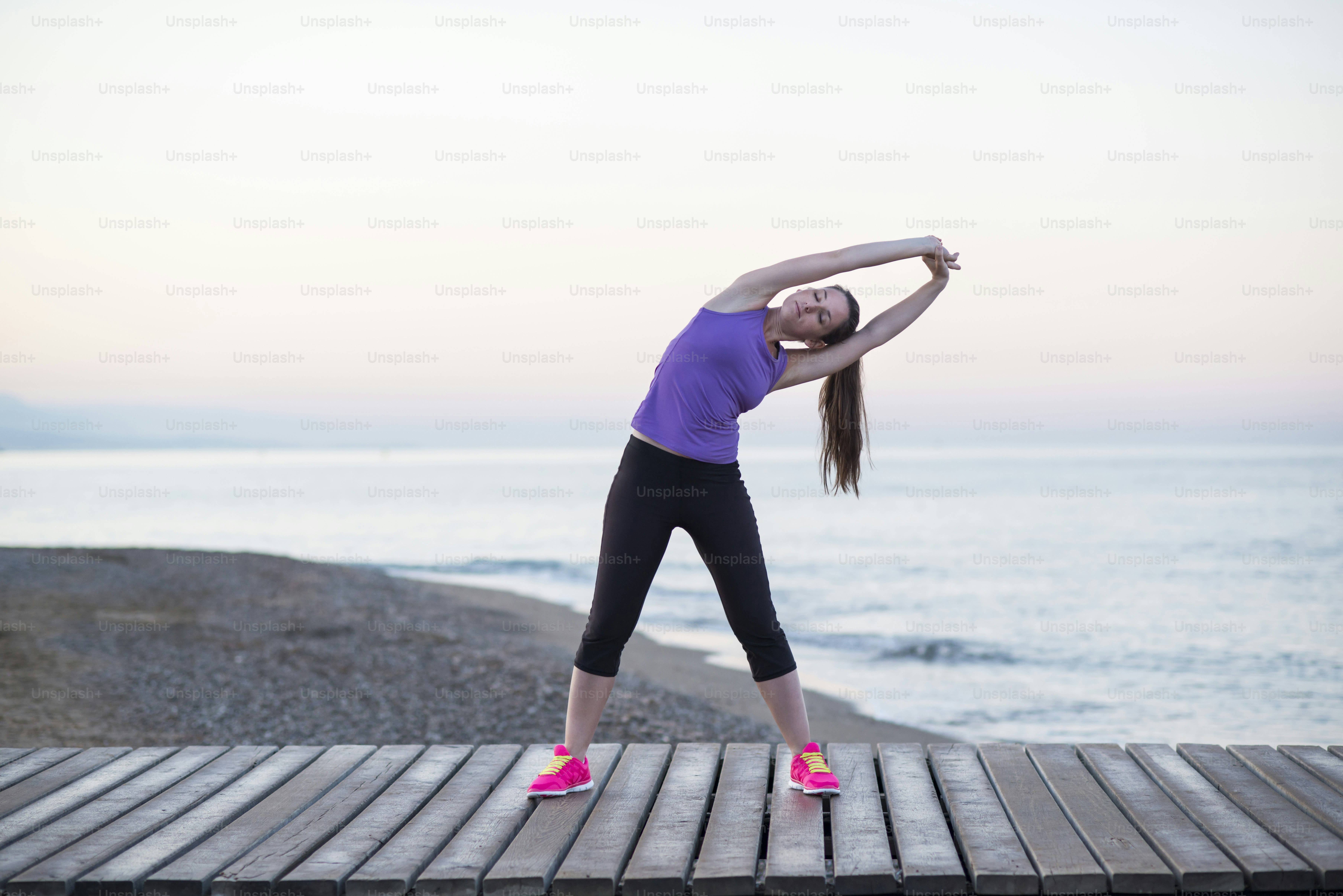 Young woman is running in sunny nature