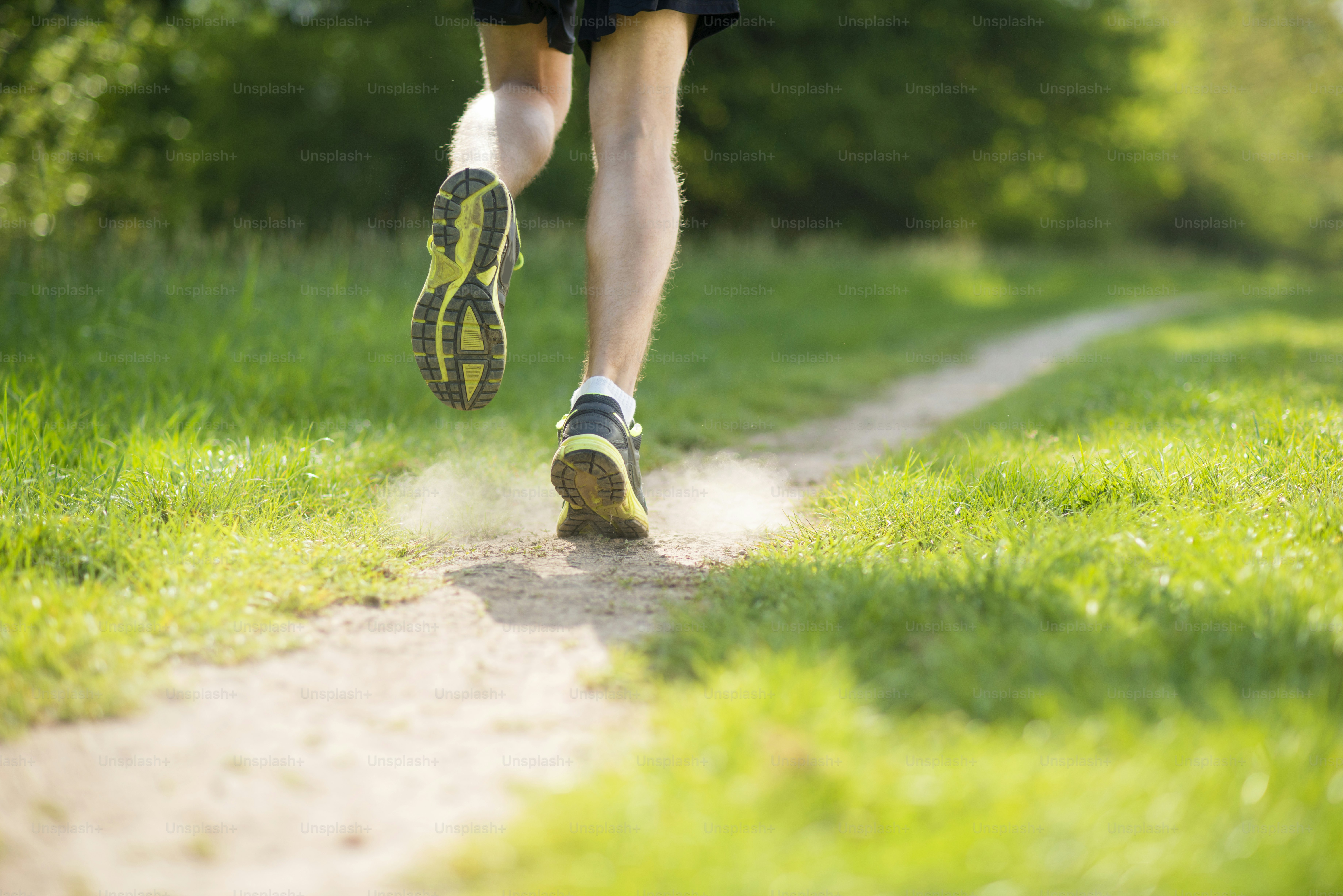 Young man is running in sunny nature photo – Shoe Image on Unsplash