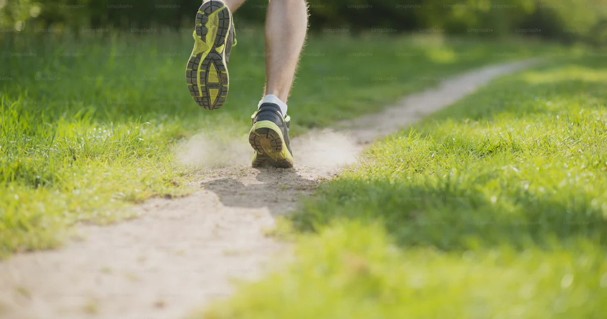Un Running Young man is running in sunny nature photo – Shoe Image on Unsplash