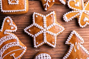 Christmas composition with gingerbreads. Studio shot on wooden background.