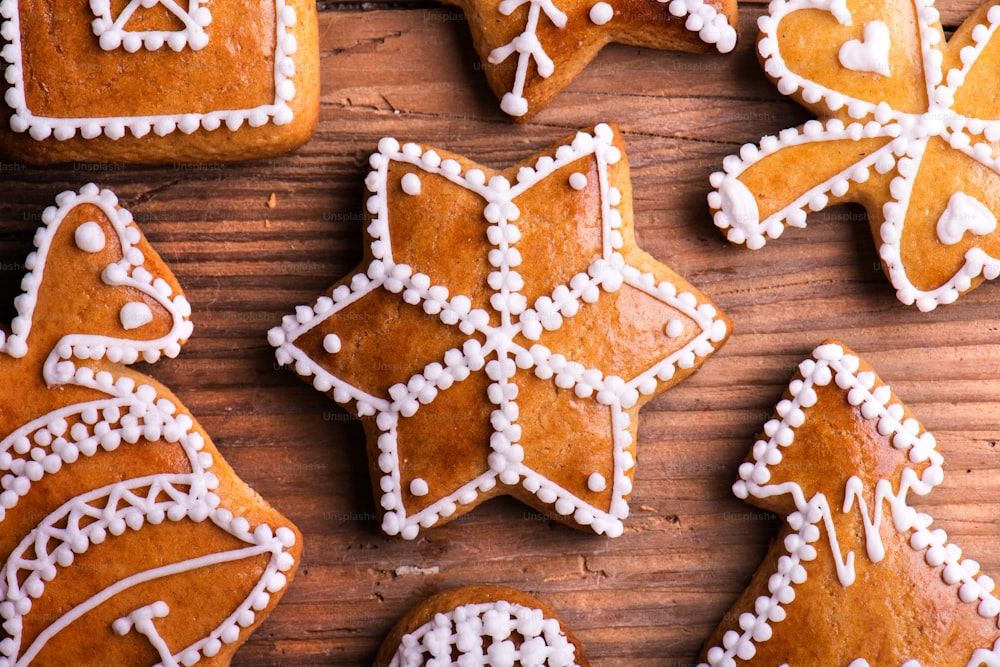 Christmas composition with gingerbreads. Studio shot on wooden background.