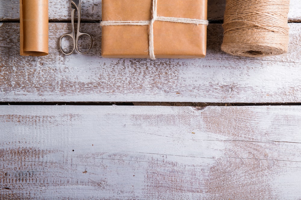 Christmas presents laid on a wooden table background
